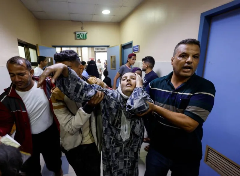 A Palestinian woman reacts after Israeli strikes, at a hospital in Khan Younis in the southern Gaza Strip, on Monday. REUTERS