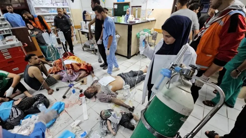 Palestinian casualties, including baby Mosab Sobieh, who is less than a year old and was injured in an Israeli strike, are assisted at the Indonesian Hospital that ran out of fuel and electricity, in the northern Gaza Strip, on Monday. REUTERS