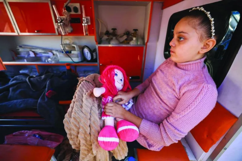 
Palestinian children wounded in Israeli strikes wait in an ambulance outside Al-Aqsa hospital in Deir al-Balah in the centre of the Gaza Strip, as they start the process of being evacuated to the United Arab Emirates in a humanitarian flight from Al Arish, in Egypt, yesterday. 