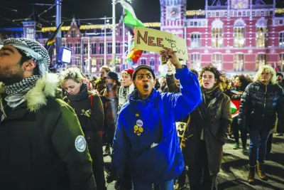 People take part in a solidarity action against exclusion and discrimination at Rotterdam's Dam square yesterday, one day after the victory of Wilders's far-right eurosceptic party in Dutch elections.