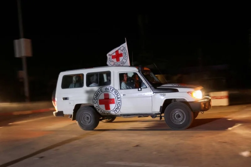 A Red Cross vehicle, as part of a convoy believed to be carrying hostages abducted by Hamas militants during the October 7 attack on Israel, arrives at the Rafah border, amid a hostages-prisoners swap deal between Hamas and Israel, in southern Gaza Strip on Friday. REUTERS