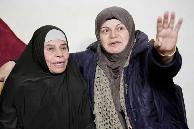 Released Palestinian prisoner Fatima Amarneh talks to her family in her house, near Jenin in the Israeli-occupied, on Friday. REUTERS