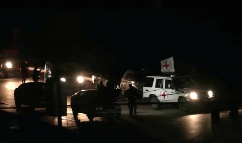 A Red Cross vehicle, as part of a convoy believed to be carrying hostage arrives at the Rafah border, amid a hostages-prisoners swap deal between Hamas and Israel, in southern Gaza Strip Saturday late night. REUTERS