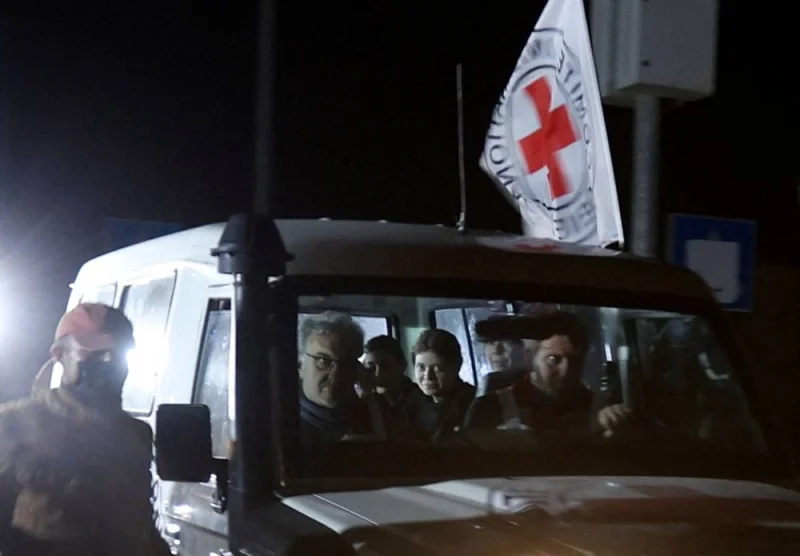 A Red Cross vehicle, as part of a convoy believed to be carrying hostages arrives at the Rafah border, amid a hostages-prisoners swap deal between Hamas and Israel, in southern Gaza Strip Saturday. REUTERS