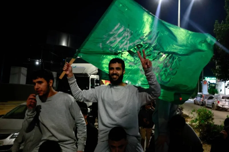 Released Palestinian prisoners react as they leave the Israeli military prison, Ofer, amid a hostages-prisoners swap deal between Hamas and Israel, in Ramallah in the Israeli-occupied West Bank on Sunday. REUTERS