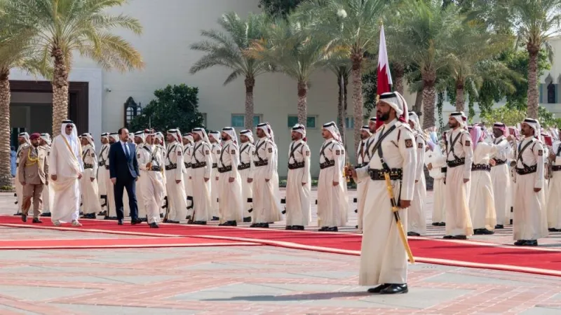 Accompanied by His Highness the Amir Sheikh Tamim bin Hamad Al-Thani, Nikos Christodoulides, the President of the Republic of Cyprus, being given a guard of honour during an official reception ceremony at Amiri Diwan.