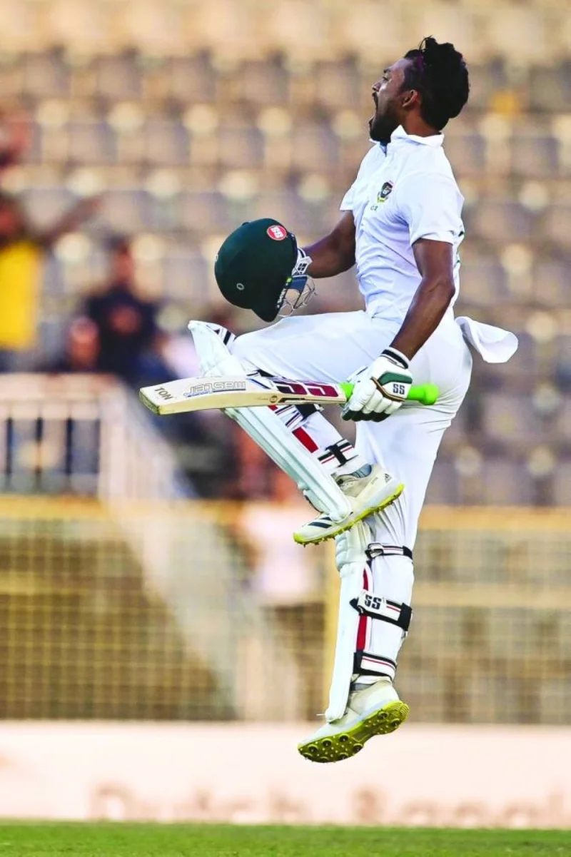 
Bangladesh’s Najmul Hossain Shanto celebrates after scoring a century during the third day of the first Test against New Zealand at the Sylhet International Cricket Stadium in Sylhet yesterday. (AFP) 