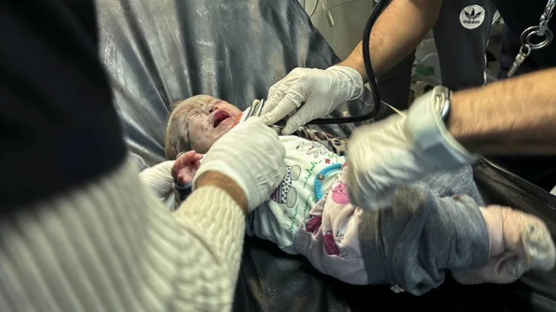 A Palestinian infant wounded in an Israeli strike on a house receives medical attention, at Nasser hospital in Khan Younis in the southern Gaza Strip, on Friday. REUTERS