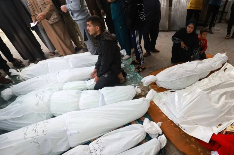 People gather to identify the bodies of family members killed in Israeli strikes on Rafah in the southern Gaza Strip, at the al-Najjar hospital on Friday. AFP