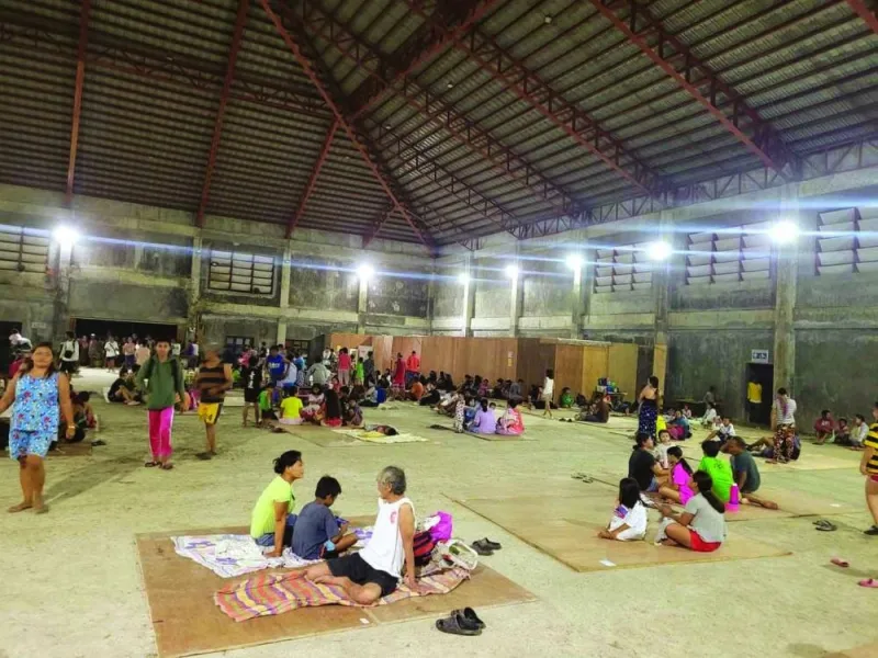 
People gather at an evacuation centre, in the aftermath of the earthquake, in Hinatuan. 