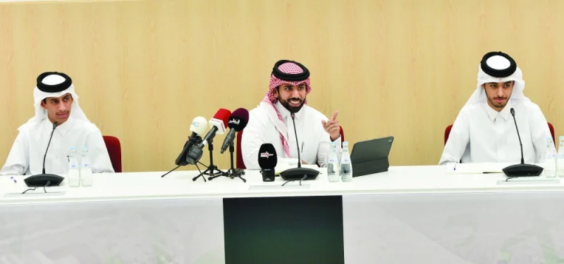 
Al Kass Channel anchor Majed al-Mansouri (centre), Qatar Academy Doha students Nayef al-Kubaisi and Mahdi Hussein al-Ahbabi address a press conference to reveal details of the  “Stand with Palestine” fundraising event at the Education City Stadium yesterday. 