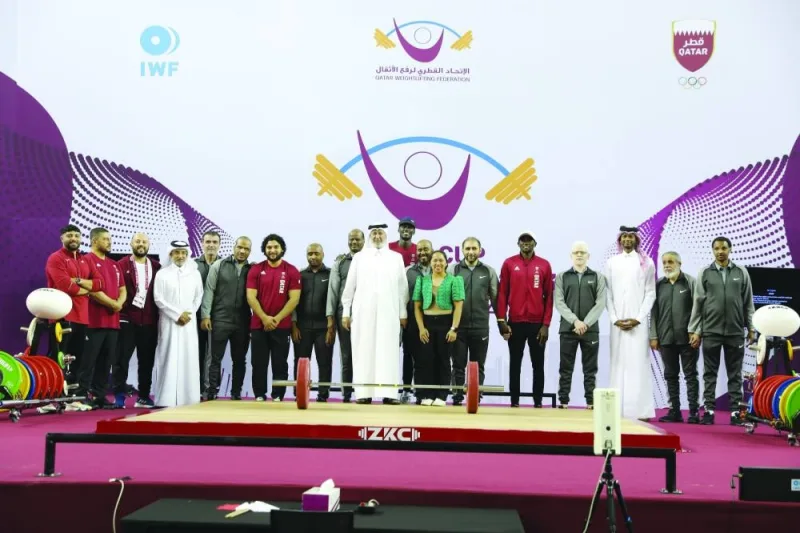 
First Vice-President of Qatar Olympic Committee Mohamed bin Youssef al-Mana poses with Tokyo Olympics gold medallists Fares Ibrahim and Mutaz Barshim along with other Olympic medallists during the opening ceremony of Qatar Cup IWF Grand Prix at the Aspire Zone in Doha yesterday. 