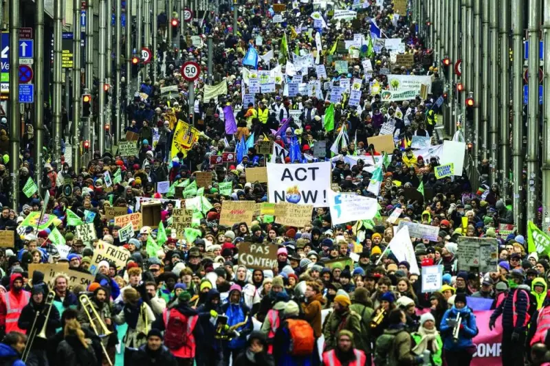CLARION CALL: Demonstrators take part in a yearly climate march in Brussels yesterday. (AFP, Reuters)