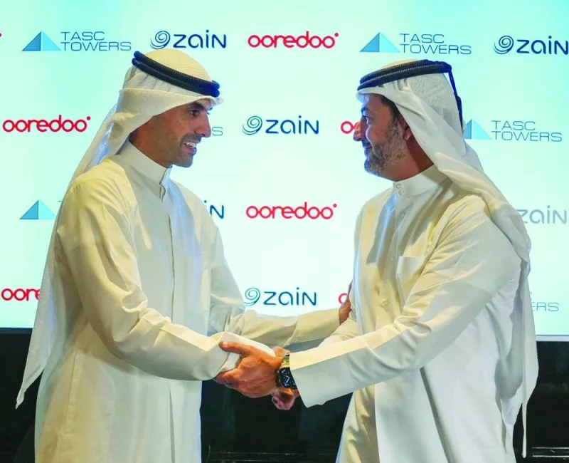Ooredoo MD and Group CEO Aziz Aluthman Fakhroo and Zain vice-chairman & Group CEO Bader al-Kharafi during the signing ceremony.