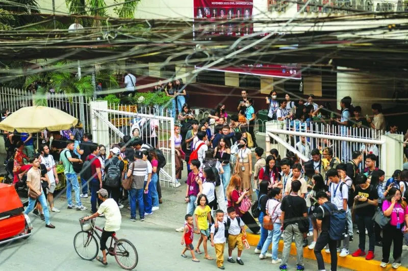 
Students evacuate following an earthquake, in Manila, Philippines, yesterday. 