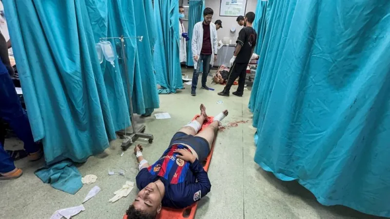 Palestinians wounded in Israeli strikes receive treatment at Nasser hospital in Khan Younis in the southern Gaza Strip, on Friday. REUTERS