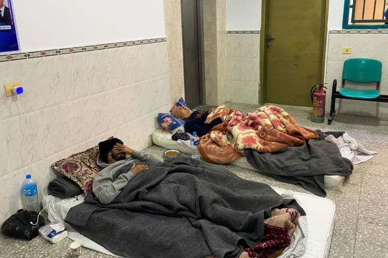 People shelter in Yafa hospital, which was damaged by Israeli strikes, in the central Gaza Strip, on Friday. REUTERS