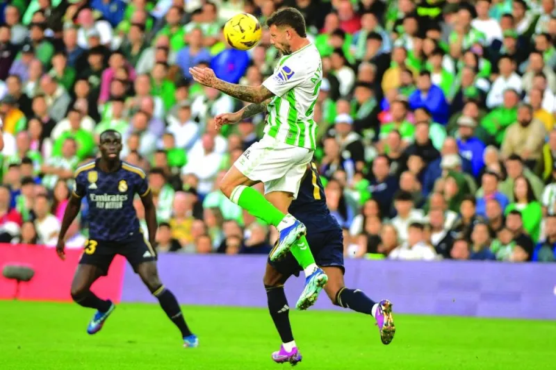 
Real Betis’ striker Aitor Ruibal heads the ball during the La Liga match against Real Madrid in Seville yesterday. (AFP) 