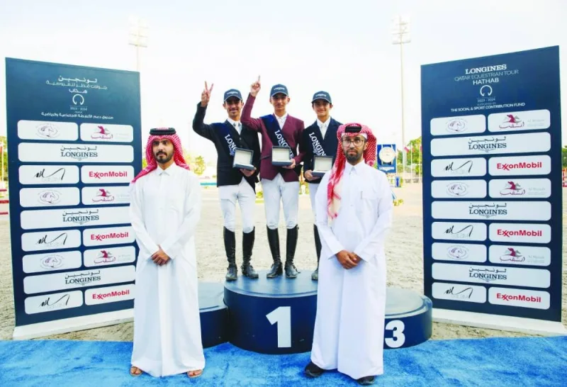 
Amateur class podium finishers pose with Dr Dafi Nasser al-Ardi, Chairman of the Medical Committee and Abdullah al-Qashouti, Media Director of the tournament. 