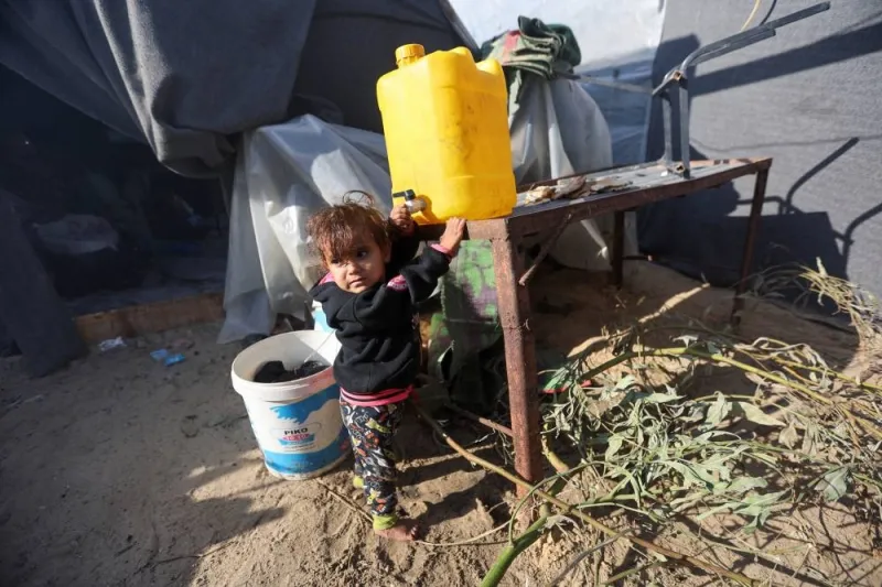 A displaced Palestinian girl, who fled her house due to Israeli strikes, shelters in a tent camp, in Khan Younis in the southern Gaza Strip, on Monday. REUTERS