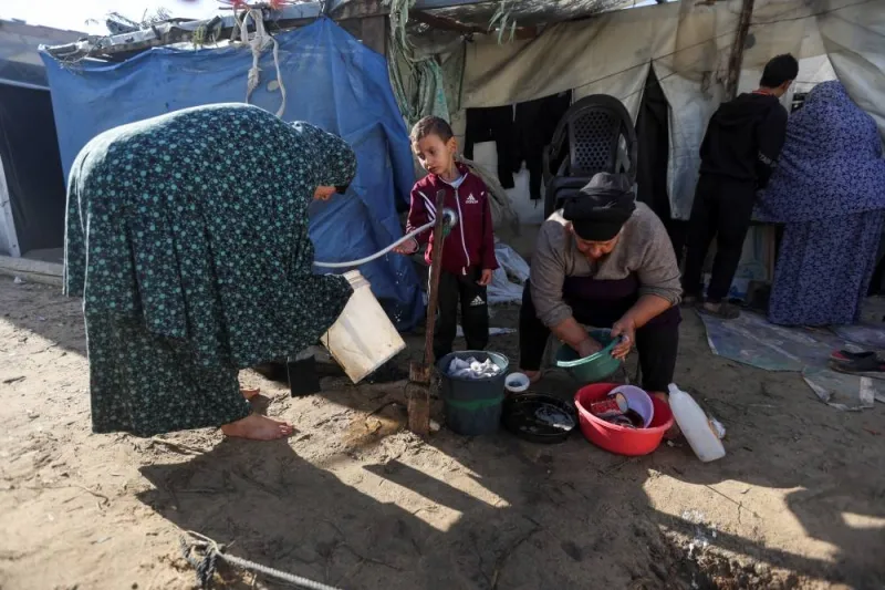 Displaced Palestinians who fled their house due to Israeli strikes shelter in a tent camp, in Khan Younis in the southern Gaza Strip, on Monday. REUTERS