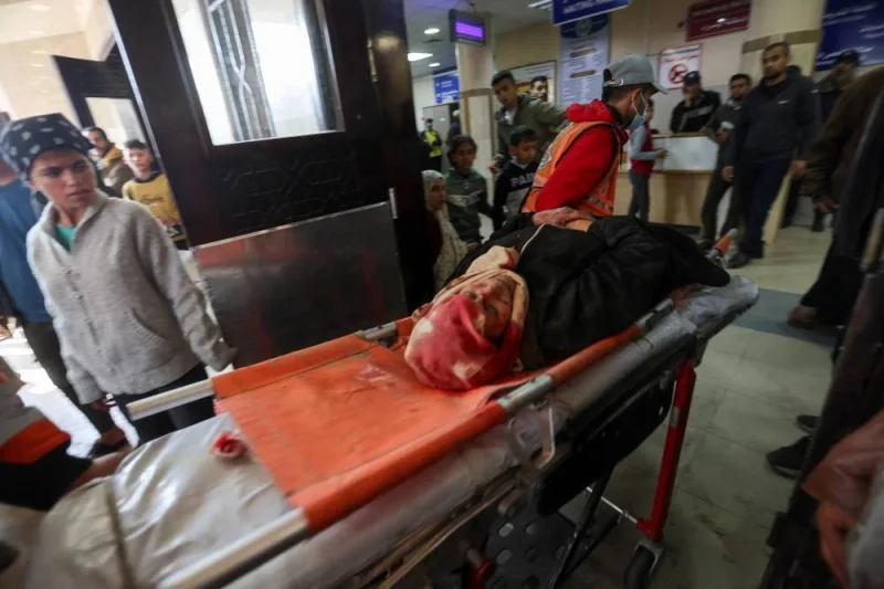A Palestinian woman wounded in Israeli strikes is rushed to Nasser hospital, in Khan Younis in the southern Gaza Strip, on Monday. REUTERS
