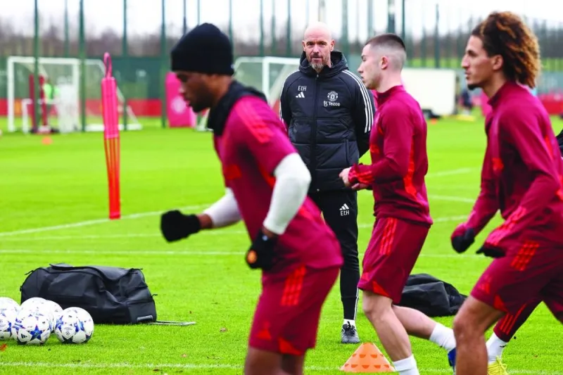 
Manchester United’s manager Erik ten Hag (centre) looks on as his players train in Manchester yesterday, ahead of the Champions League match against Bayern Munich. (AFP) 