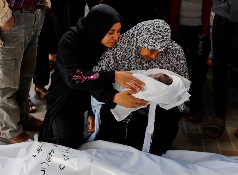 The grandmother of Palestinian baby Idres Al-Dbari, who was born during the war and killed in an Israeli strike, reacts at Abu Yousef al-Najjar hospital in Rafah in the southern Gaza Strip, on Tuesday. REUTERS