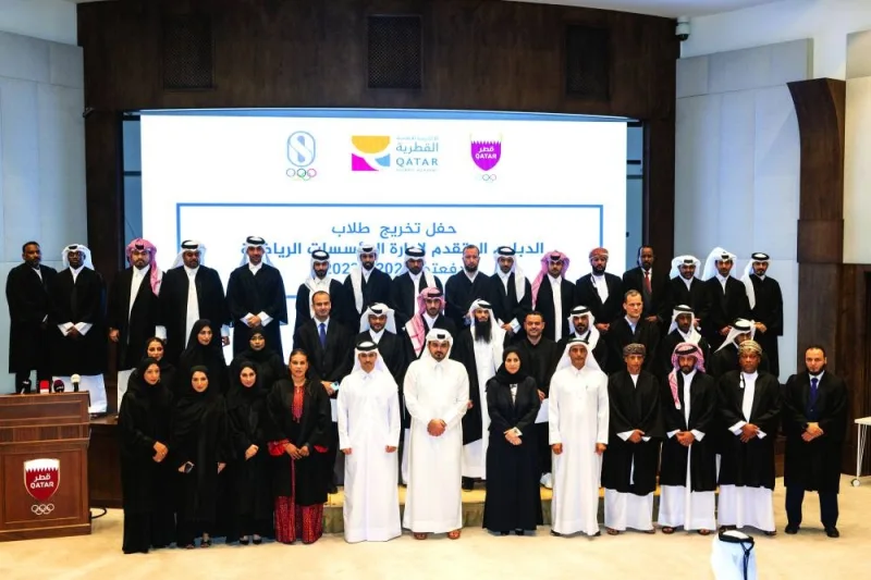 
President of the Qatar Olympic Committee HE Sheikh Joaan bin Hamad al-Thani and other officials pose with the graduates of the advanced diploma in Sports Institution and Olympic Management. 