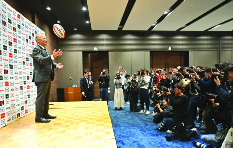 
Eddie Jones poses with a ball during a photo session at a press conference after being named as Japan rugby head coach in Tokyo yesterday. Jones said that he did not “feel any guilt at all” about becoming Japan’s head coach, six weeks after he walked out on the Wallabies. (AFP) 