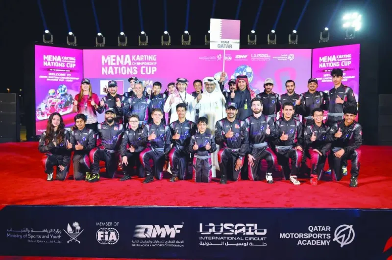 Qatar Motor and Motorcycle Federation (QMMF) and Lusail International Circuit President Abdulrahman al-Mannai, QMMF’s Secretary General Abdulrazaq al-Kuwari and Executive Director Amro al-Hamad pose with the Qatar Motorsports Academy drivers during the opening ceremony of MENA Karting Championship Nations Cup 2023 at the Lusail International Circuit’s karting track yesterday.