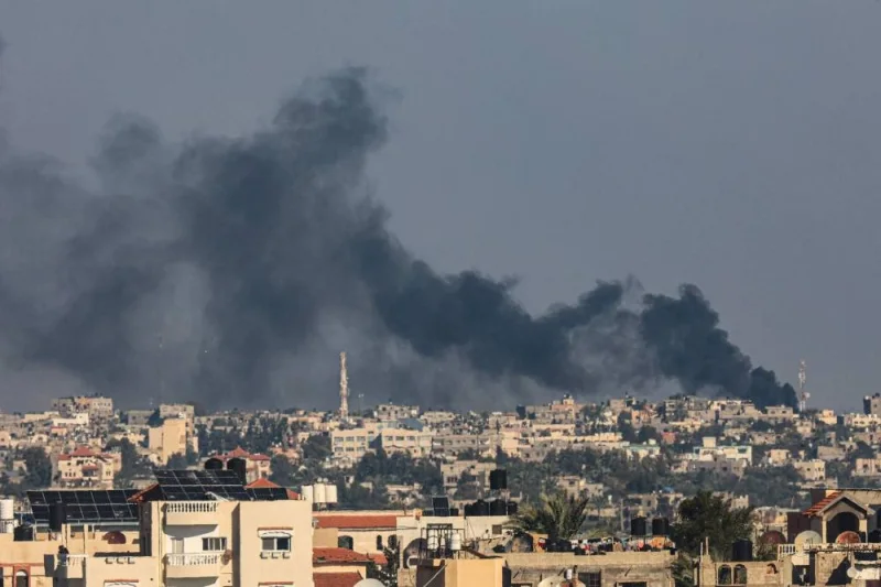 A picture taken from Rafah shows smoke billowing over Khan Yunis in the southern Gaza Strip following Israeli bombardment, on Friday. AFP