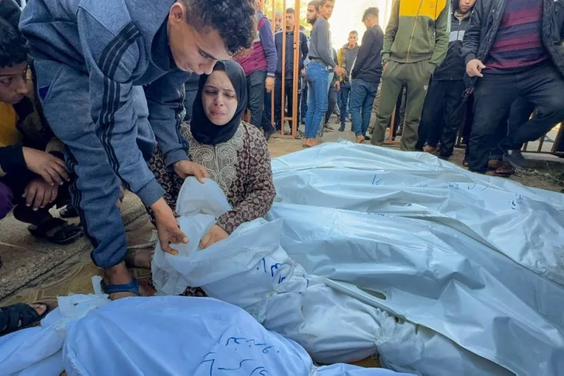 A mourner reacts next to the bodies of Palestinians killed in Israeli strikes, at Nasser hospital in Khan Younis in the southern Gaza Strip, on Friday. REUTERS