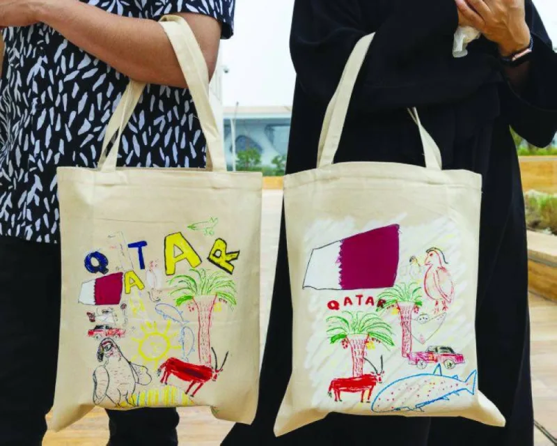 Tote bags displaying another set of artworks