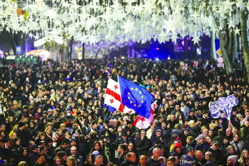 TOPSHOT - Georgians rally to celebrate the country's European Union candidate status in Tbilisi on December 15, 2023. (Photo by Giorgi ARJEVANIDZE / AFP)