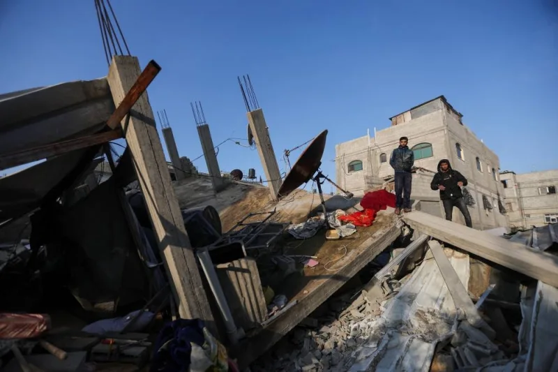 Palestinians inspect the site of an Israeli strike on a house in Rafah in the southern Gaza Strip, on Sunday. REUTERS