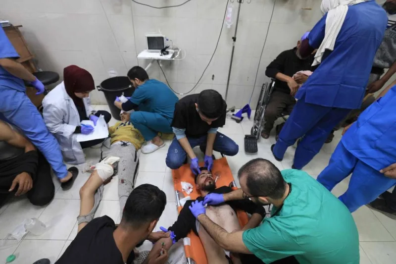 Medics treat Palestinians injured in Israeli bombardment, at Nasser hospital in Khan Yunis in the southern Gaza Strip, on Sunday. AFP