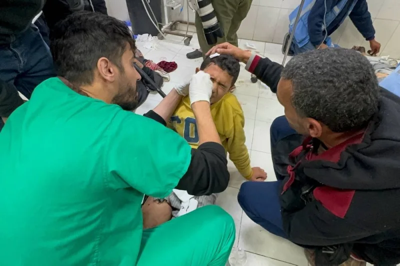 A Palestinian child who was wounded in an Israeli strike receives treatment at Nasser hospital in Khan Younis, in the southern Gaza Strip, on Sunday. REUTERS