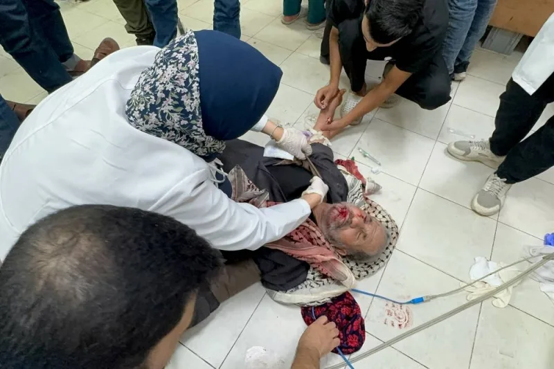 A Palestinian man who was wounded in an Israeli strike is treated at Nasser hospital in Khan Younis, in the southern Gaza Strip, on Sunday. REUTERS