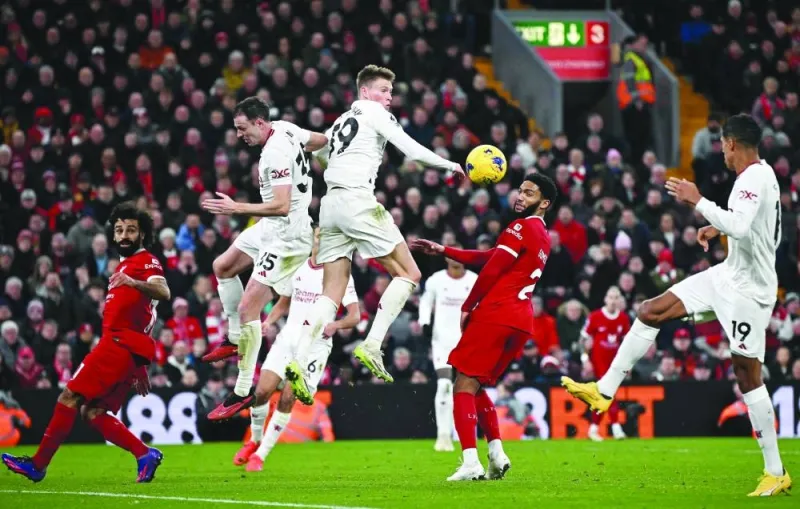 
Manchester United Jonny Evans (second from left) and Scott McTominay (centre) jump to defend a corner during the English Premier League match against Liverpool at Anfield in Liverpool yesterday. (AFP) 