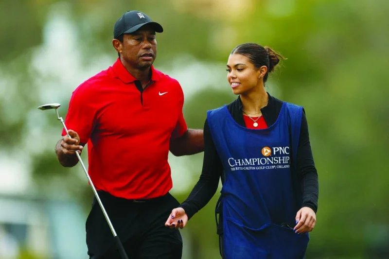 
Tiger Woods of the United States walks on the 18th green with daughter and caddie Sam Woods during the final round of the PNC Championship at The Ritz-Carlton Golf Club in Orlando, Florida. (AFP) 