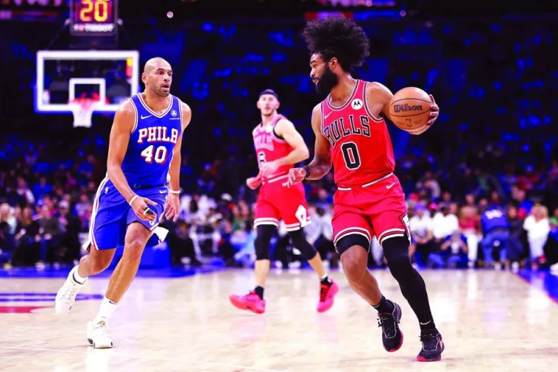 
Coby White of the Chicago Bulls dribbles past Nicolas Batum of the Philadelphia 76ers during the second quarter of their NBA game at the Wells Fargo Center in Philadelphia, Pennsylvania. (AFP) 