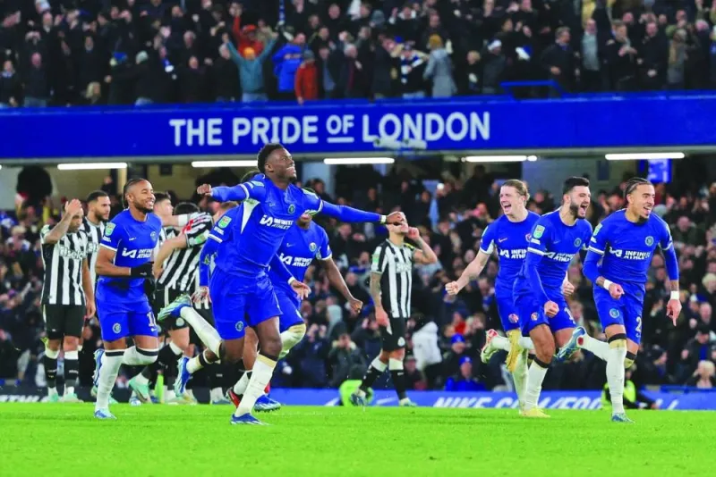 
Chelsea’s players celebrate after winning the penalty shoot out against Newcastle United to enter the League Cup semi-finals. (AFP) 