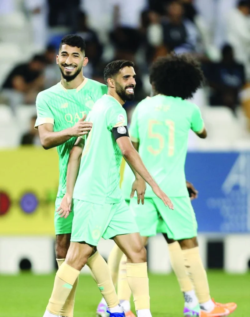 Al Sadd’s Hassan al-Haydos (centre) celebrates with teammates after scoring against Umm Salal during the Expo Stars League match at the Jassim Bin Hamad Stadium on Thursday.