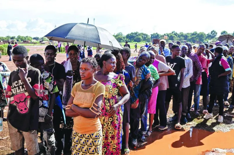 
Voters queue yesterday as they wait to cast their ballots at a polling station at Bwakya school in the DR Congo’s Lubumbashi. 