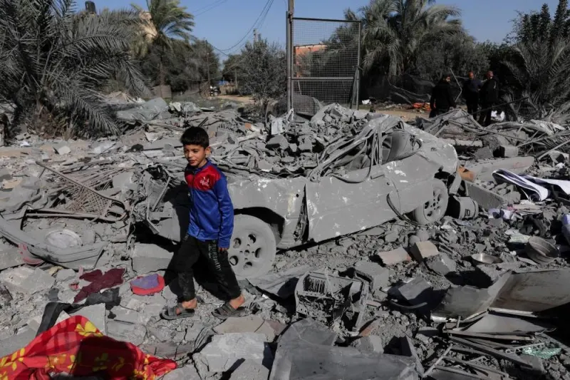 A Palestinian child walks at the site of an Israeli strike on a house in the southern Gaza Strip, on Friday. REUTERS