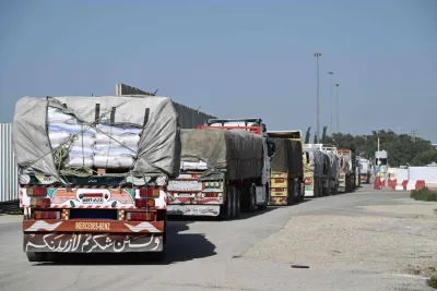 Trucks carrying humanitarian aid arrive from Egypt to the Israeli side of the Kerem Shalom border crossing with the southern Gaza Strip on Friday. AFP