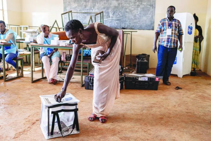 
A voter casts her ballot at a polling station at Bwakya school in Lubumbashi. 