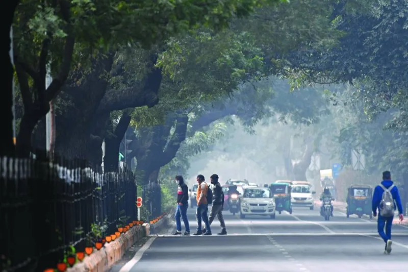 Commuters cross a road amid smoggy conditions in New Delhi (file). In its latest report, the Global Knowledge Partnership on Migration and Development said as in 2023, remittances’ growth in South Asia is once again projected to be the highest among low and middle-income countries in 2024, even though it is projected to moderate to 5% in 2024 from 7.2% in 2023.