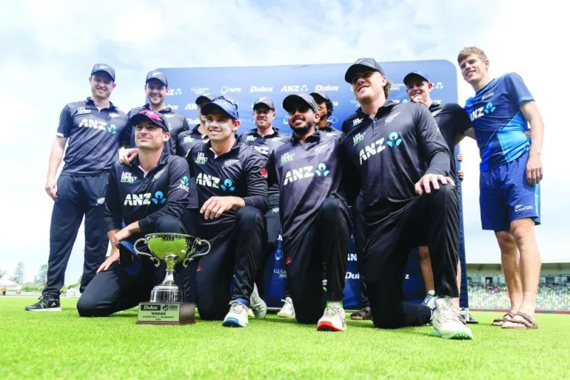 New Zealand players pose with the ODI series trophy after the third match against Bangladesh at McLean Park in Napier on Saturday. (AFP)